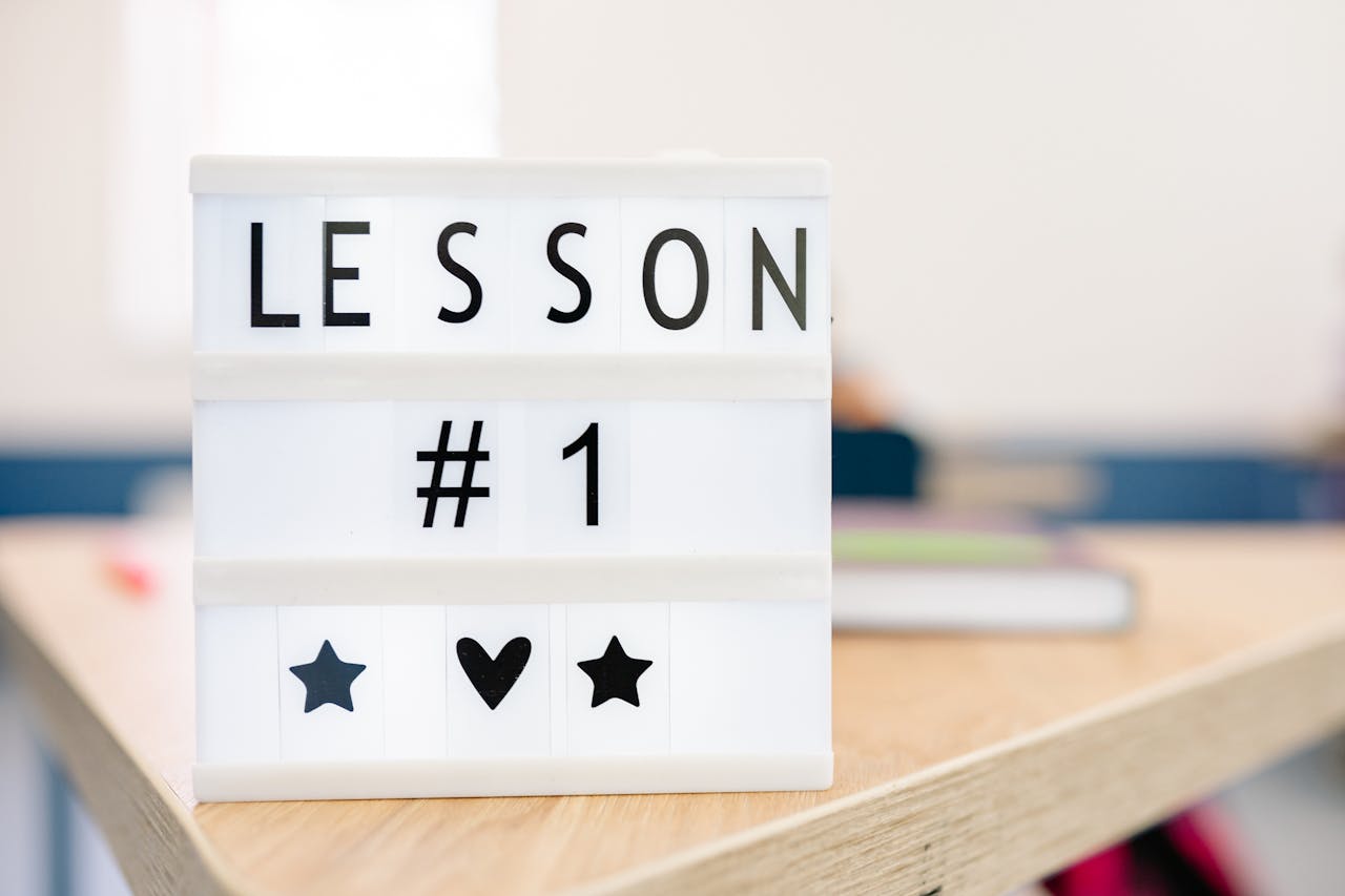 services-03 Lightbox sign displaying 'Lesson #1' in a classroom setting, symbolizing education and new beginnings.